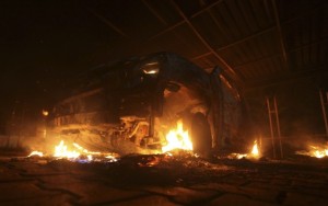 A car burns outside the US Embassy in Libya on Tuesday.
